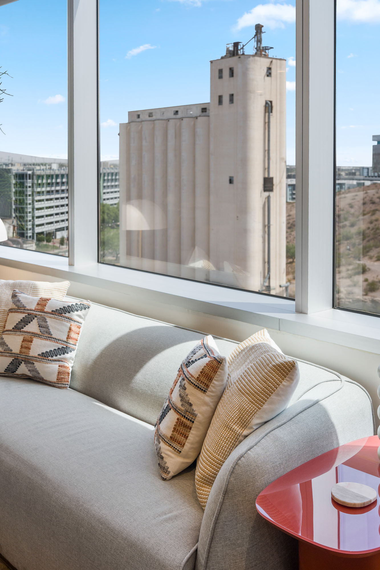 Window seating area with city view and cushions in Tempe, Arizona office