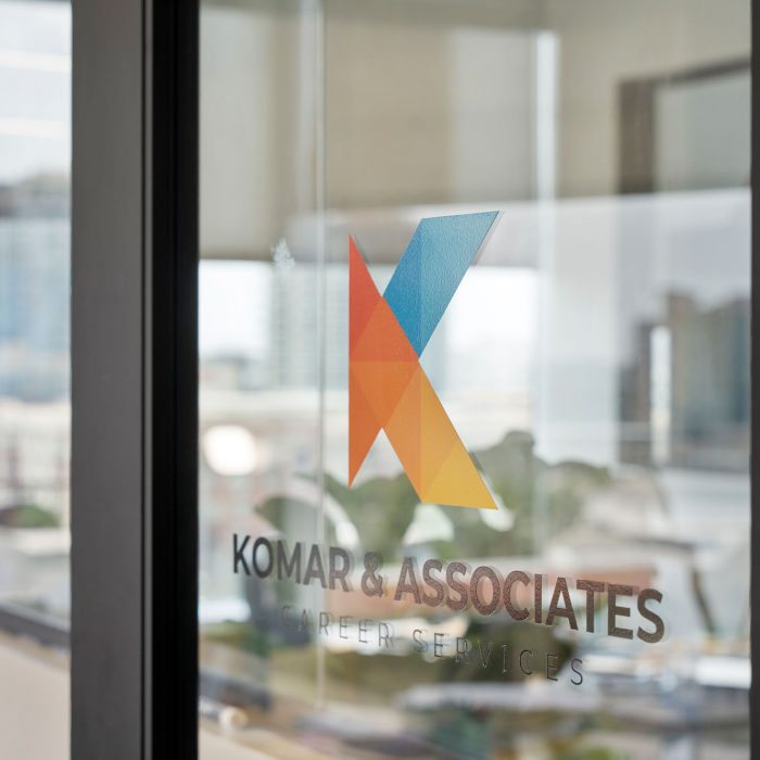 Komar and Associates Private career counseling service logo on glass entrance door in Tempe
