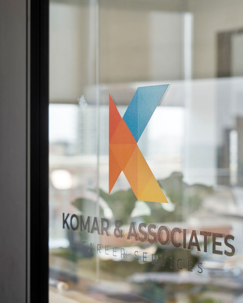 Komar and Associates Private career counseling service logo on glass entrance door in Tempe