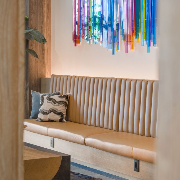 Bench seating area with colorful wall art in Tempe counseling office