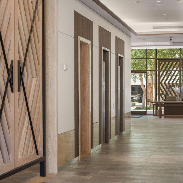 Hallway with wood paneling in Komar and Associates Tempe office
